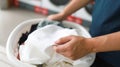 House husband with Basket and dirty laundryÃÂ washed clothing in laundry room interior. washing machineÃÂ 